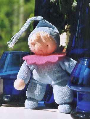 Little lightblue cuddle-doll