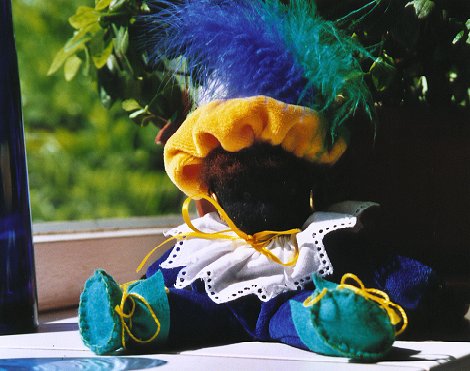 This 'Black Peter' (Zwarte Piet) is the friendly helper of St.Nicolas (Sinterklaas), friend of all the children in Holland, who celebrates his birthday on the 5th of December